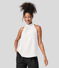 Ærmeløs Nicole-bluse med halterneck-design og afslappet