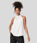 Ærmeløs Nicole-bluse med halterneck-design og afslappet