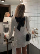 Greta - Elegant midikjole med glimmer og glans