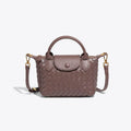 Athena - Kompakt crossbody-taske med vævet tekstur