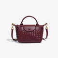 Athena - Kompakt crossbody-taske med vævet tekstur