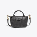 Athena - Kompakt crossbody-taske med vævet tekstur