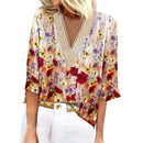 Joyce - Stilfuld bluse med blomsterprint, korte ærmer og