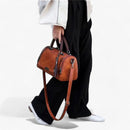 Juliana - rendy og funktionel crossbody-taske med kvastdetalje