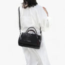 Juliana - rendy og funktionel crossbody-taske med kvastdetalje