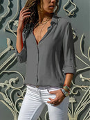 Emily - Elegant bluse med knaplukning og oprullede ærmer