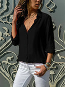 Emily - Elegant bluse med knaplukning og oprullede ærmer