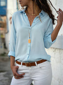Emily - Elegant bluse med knaplukning og oprullede ærmer