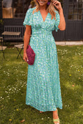 Ruth - Stilfuld plisseret V-hals kjole med blomsterprint