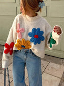 Blomsterstrikket sweater i blødt stof