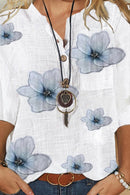 Elanora - Bluse med blomsterprint, V-hals og knapdetaljer