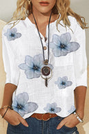 Elanora - Bluse med blomsterprint, V-hals og knapdetaljer