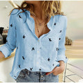 Skylar - Knap-op bluse med fugleprint og afslappet pasform