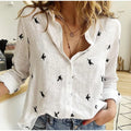 Skylar - Knap-op bluse med fugleprint og afslappet pasform